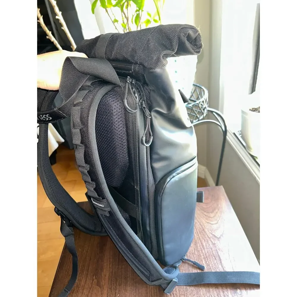 WANDRD PRVKE Lite travel camera backpack black roll-top closure magnetic handles